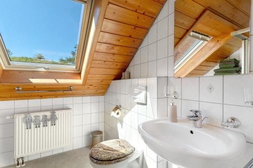 a bathroom with a sink and a window at Schwarzwald Buchenhof in Zell am Harmersbach