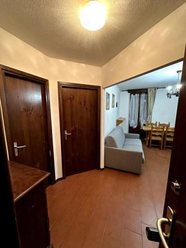 a living room with a couch and a table at Appartamento Bardonecchia in Bardonecchia
