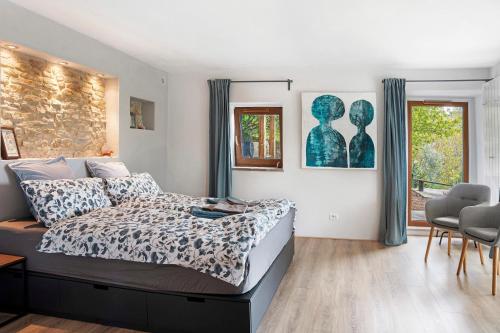 a bedroom with a bed and a table and chairs at Casa Rea in Murazzano