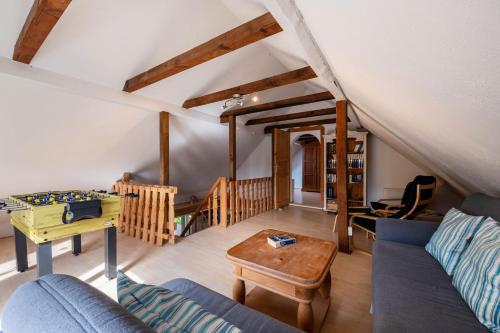 a living room with a couch and a table at Dat Haddehuus in Wangerland