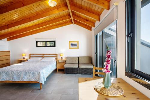 a bedroom with a bed and a window at The Wave House - Oceanfront in Jardim do Mar