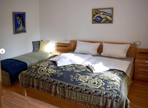a bedroom with a bed with a book on it at Landhaus Eva-maria in Elbingerode