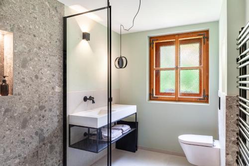 a bathroom with a sink and a toilet at Chalet Flocke Appart Schneehase in Sankt Anton am Arlberg