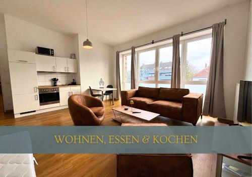 a living room with a couch and a table at Flexi Flats in Lingen