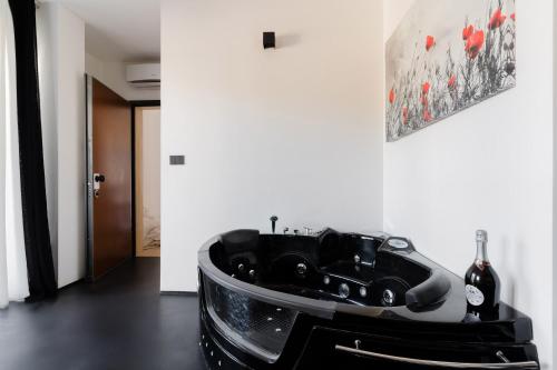 a black car on a table in a room at Suite Black and White in Otranto