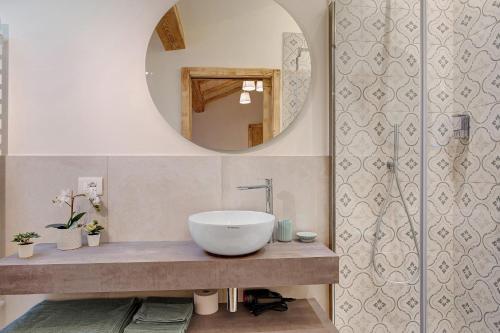 a bathroom with a sink and a mirror at Wellness Lodge Chicca in Santa Giuliana