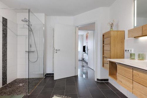 a bathroom with a shower and a sink at Fewo Am Otterbach in Jockgrim