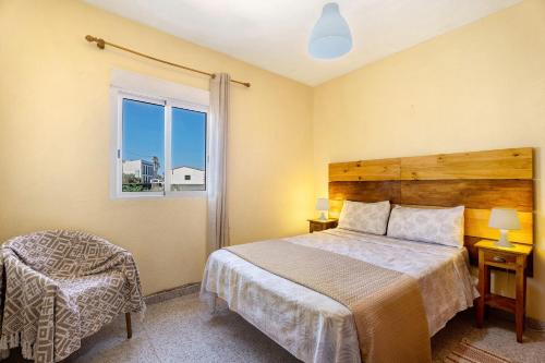 a bedroom with a bed and a window at Casa Maruca 1 in Valverde