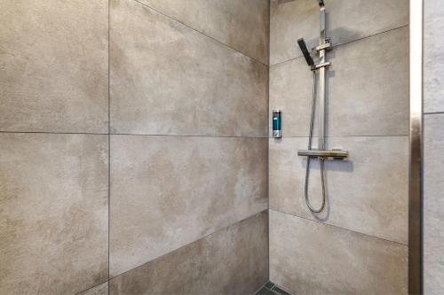a bathroom with a shower with a shower head at Ferienwohnung aufm Weinberg in Schwandorf in Bayern