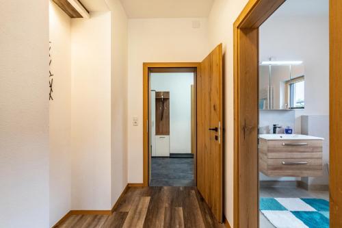 a bathroom with a sink and a mirror at Steinwender in Kaltenbach