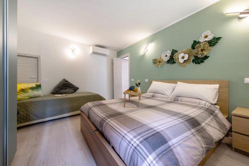 a bedroom with a large bed and a couch at Le Lavande in Castro
