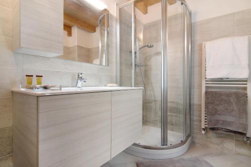 a bathroom with a shower and a sink at Borgo Vico in Verceia