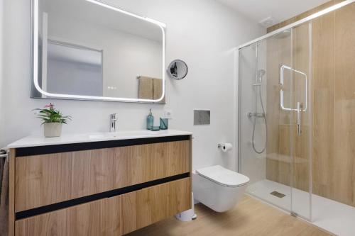a bathroom with a toilet and a sink and a shower at La Lajita Beach Estudio in Lajita