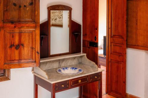a bathroom with a sink and a mirror at Ses Solls in Petra