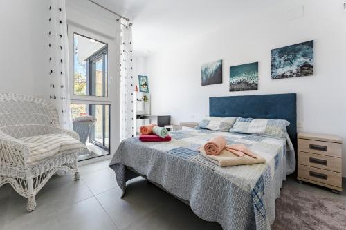 a bedroom with a bed with towels on it at Apartamento Novasol in Fuengirola
