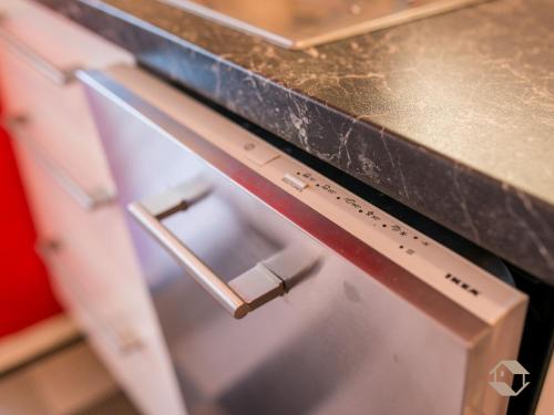 a close up of a refrigerator under a counter at Ferienwohnung Knopf in Schömberg