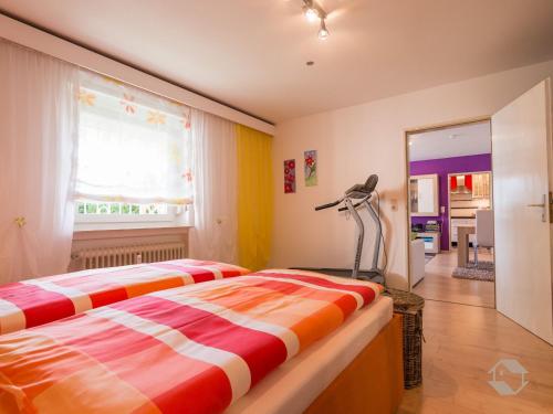 a bedroom with two beds and a lamp in it at Ferienwohnung Knopf in Schömberg