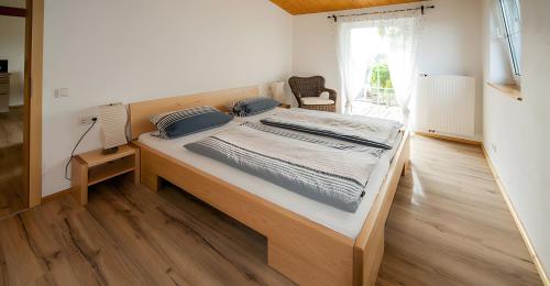 a bedroom with a large bed in a room at Ferienwohnung Aichem in Radolfzell am Bodensee