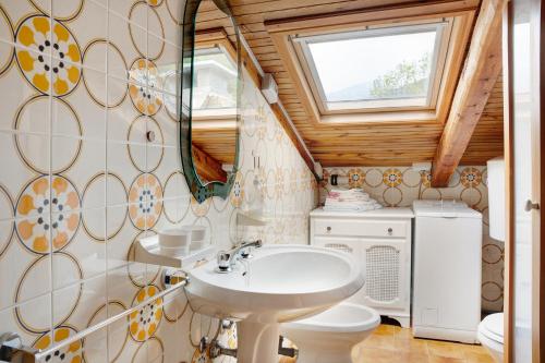 a bathroom with a sink and a toilet at Casa Sasia in Casteldelfino