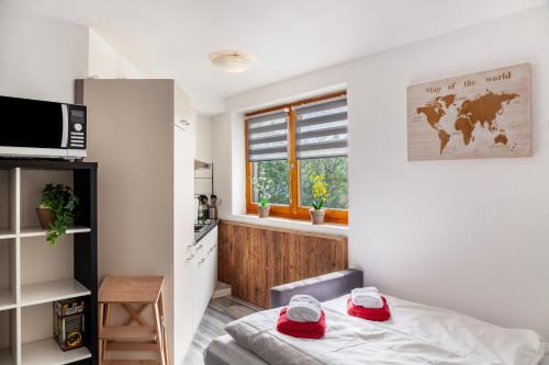 a small room with a bed and a window at Haus Auner Top 5b in Westendorf