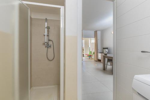 a bathroom with a shower and a sink at Residenza Cormorani 2 in Golfo Aranci
