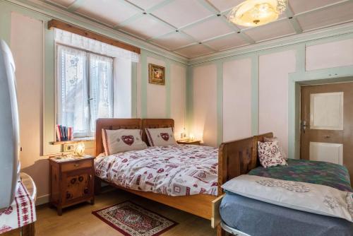 a bedroom with a bed and a window at Casa Sicina Alberto in Valfloriana