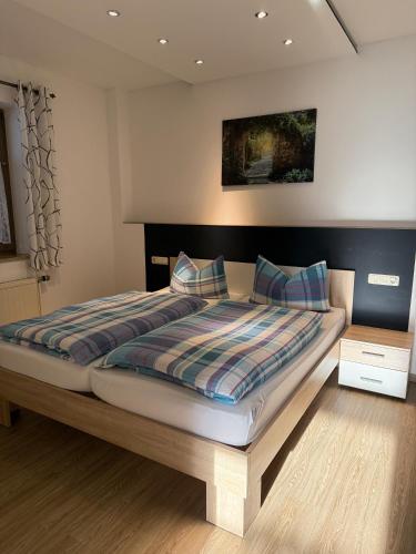 a bedroom with a large bed in a room at Ferienwohnung M Keller in Hollfeld