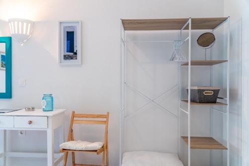 a room with a book shelf and a desk at Pleasure Corfù Fish in Agios Georgios