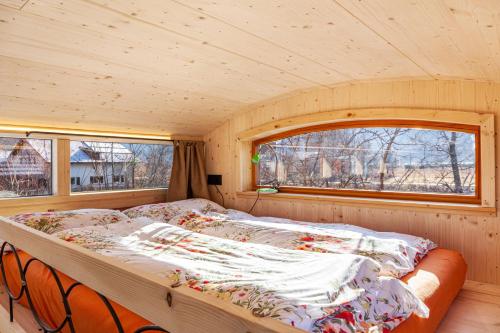 a bed in a room with a window at Loft Süd in Unterammergau