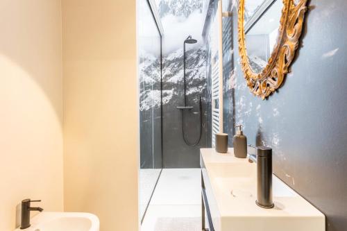 a bathroom with two sinks and a shower at Mandello amorevole dimora in Lecco in Lecco
