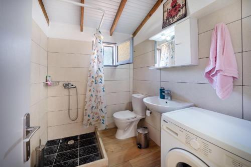 a bathroom with a toilet and a sink at Grenta Country House in Corfu