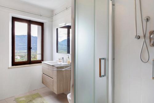 a bathroom with a shower and a sink at Villa Bivai in Bivai
