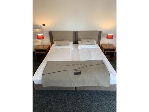 a bedroom with a bed with a white bedspread at Ferienwohnung Max 2 in Garmisch-Partenkirchen