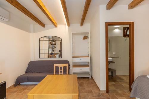 a bedroom with a bed and a table at Oltremare in Riparbella