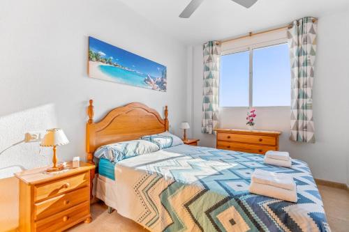a bedroom with a bed and a window at Apartment in Bolnuevo in Bolnuevo