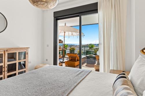 a bedroom with a bed and a view of the ocean at Sea View near La Cala & Marbella in Mijas Costa