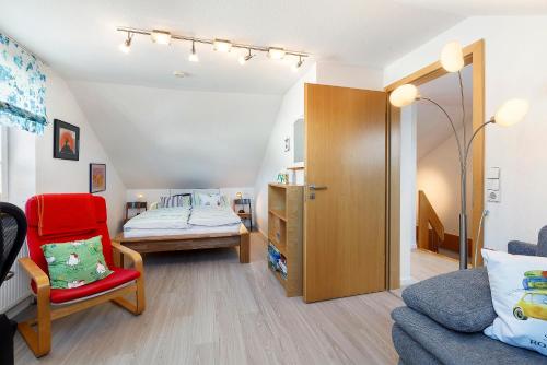 a small room with a bed and a couch at Haus Frank in Wehr