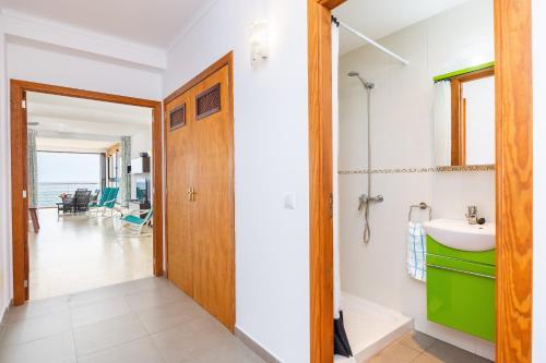 a bathroom with a sink and a mirror at Brisas Vista Mar in Sa Ràpita
