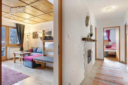 a living room with a couch and a fireplace at Xxl-appartement Moarhof in Sand in Taufers