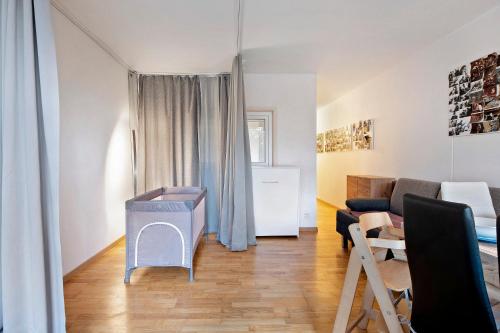 a living room with a couch and a table at Blackforest Perla in Höchenschwand