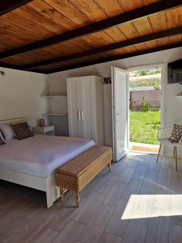 a bedroom with a bed and a sliding glass door at Casa Deco in San Borondón