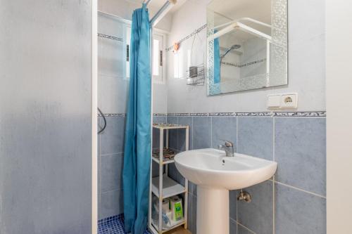 a bathroom with a sink and a shower at Moby Dick in Benidorm