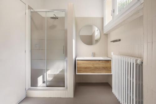 a bathroom with a sink and a mirror at Villa Brancolino - Fine Living in Garda