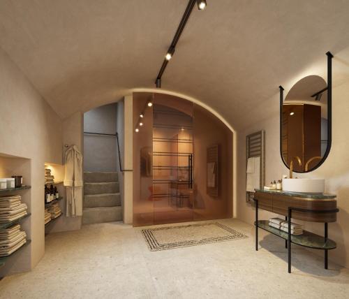 a bathroom with a sink and a mirror at La Maison in Salzburg