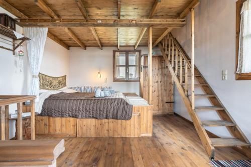 a bedroom with a bed and a staircase at Traditional Thea Home Vati Rhodes in Vátion