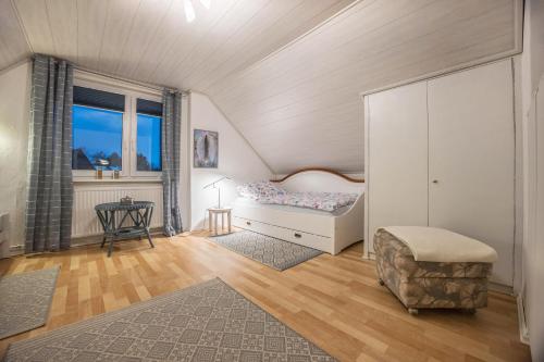 a small bedroom with a bed and a window at Gästeapartment Hannover in Hannover