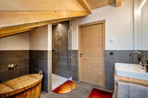 a bathroom with a shower and a sink at Krämerhof Apt Aferer Geisler in Rodengo