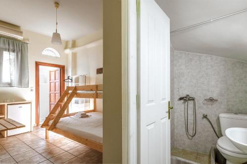 a bathroom with a bunk bed and a toilet at En Tino Basement 5 in Tinos