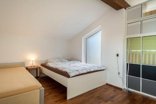a small bedroom with a bed and a closet at Kilian in Schwarzach