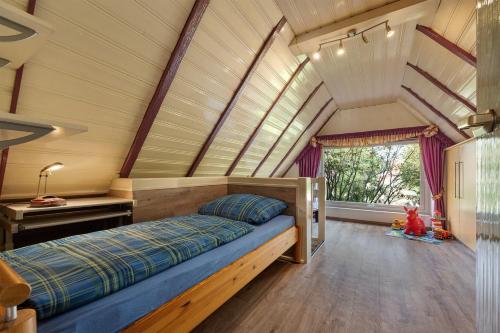a bedroom with a bed in a room at Ferienhaus In Oerrel Mit Pool in Munster
